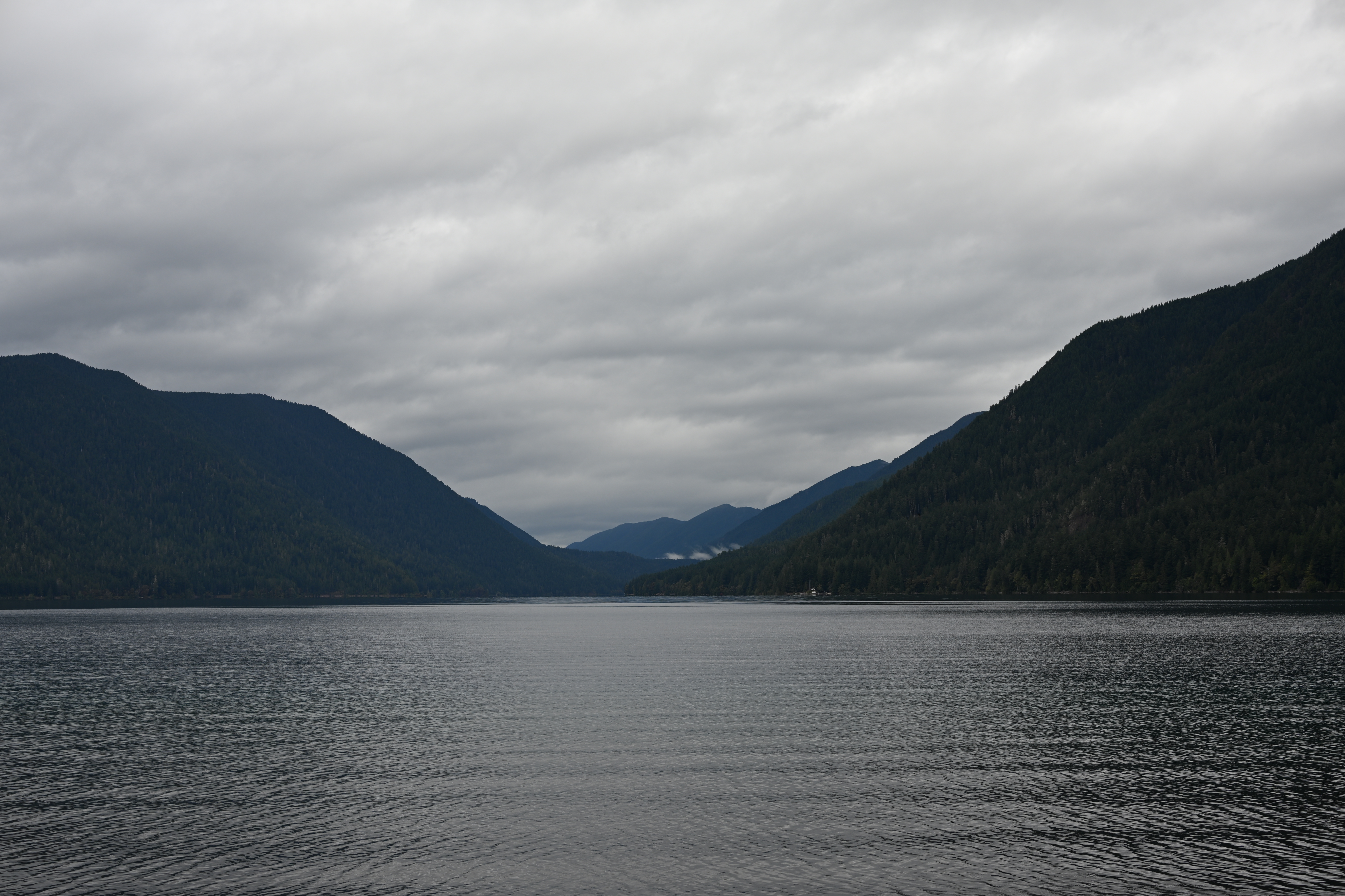 Stunning blue waters of Lake Crescent with forested mountains